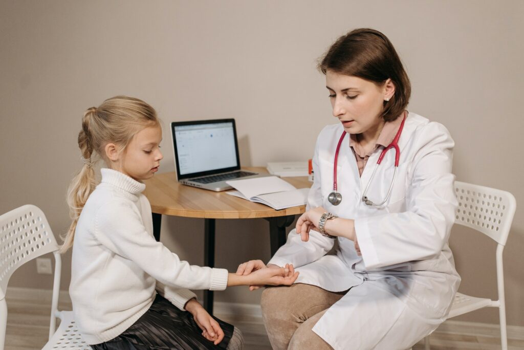 A Doctor Examining a Child Patient